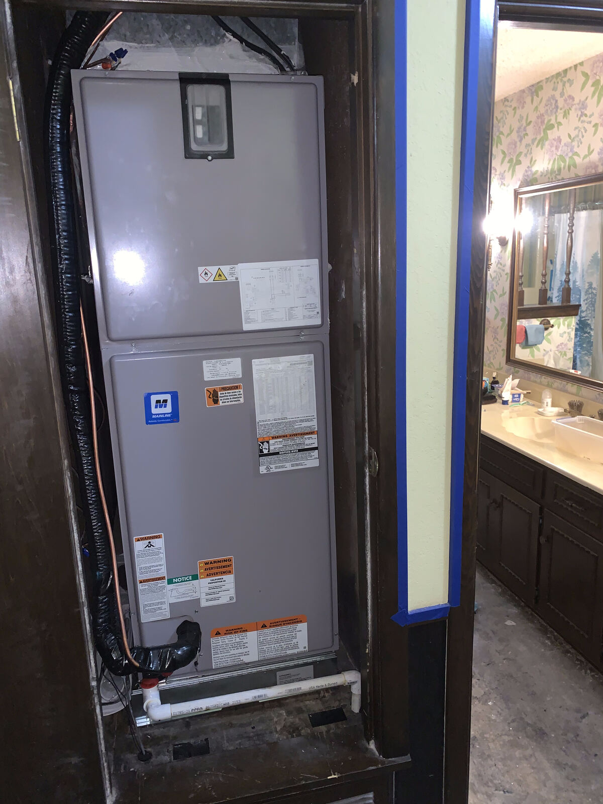 Mainline air handler installed in a closet